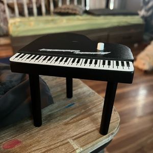 Kidskraft piano and chair and plant